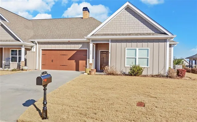 a front view of a house with garden