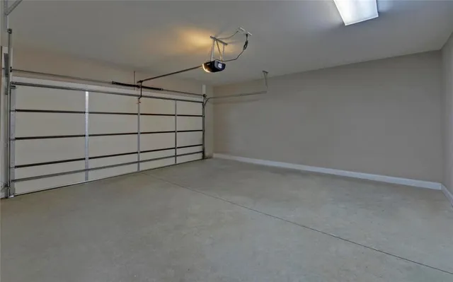 an empty room with a projector and a fan