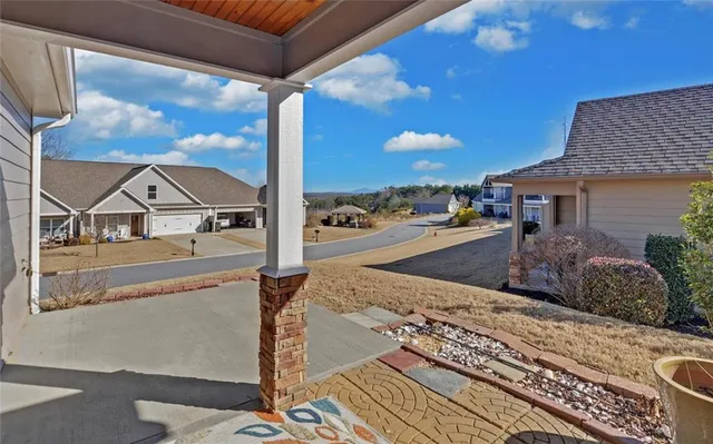 a view of a patio with a table and chairs