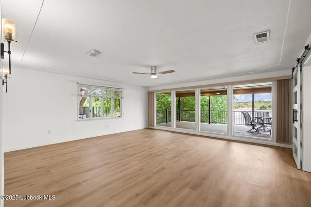 a kitchen with granite countertop a sink stove cabinets and refrigerator