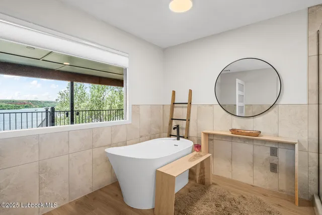 a room with sink and mirror