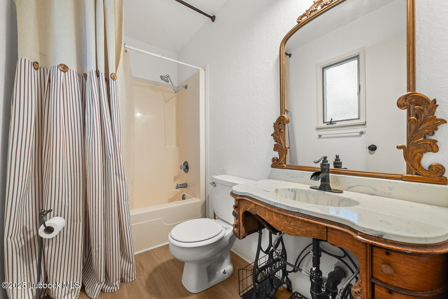 146 Pony Express Trail Buffalo Springs, TX 79404 - Photo 20 of 48 a bathroom with a sink a toilet and shower