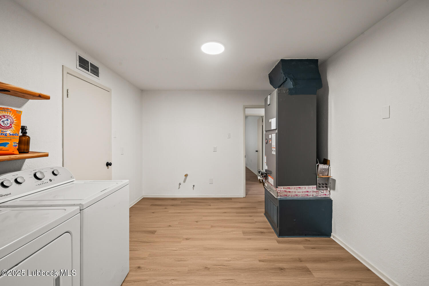 146 Pony Express Trail Buffalo Springs, TX 79404 - Photo 23 of 48 a view of utility room with washer and dryer