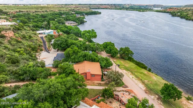 an aerial view of a house with a lake view