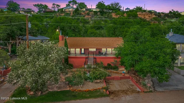 a view of a table and chairs in front of house