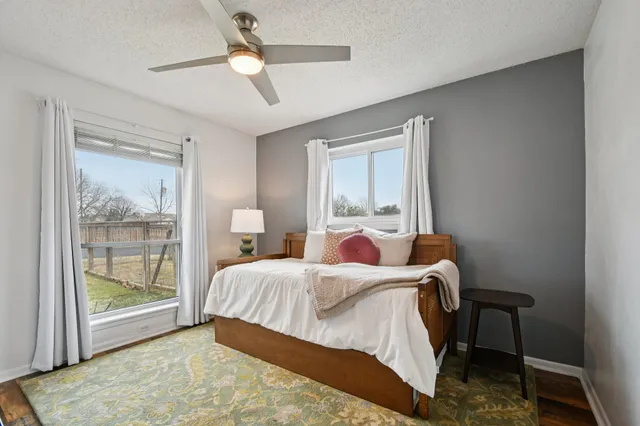 a bedroom with a bed and a mirror