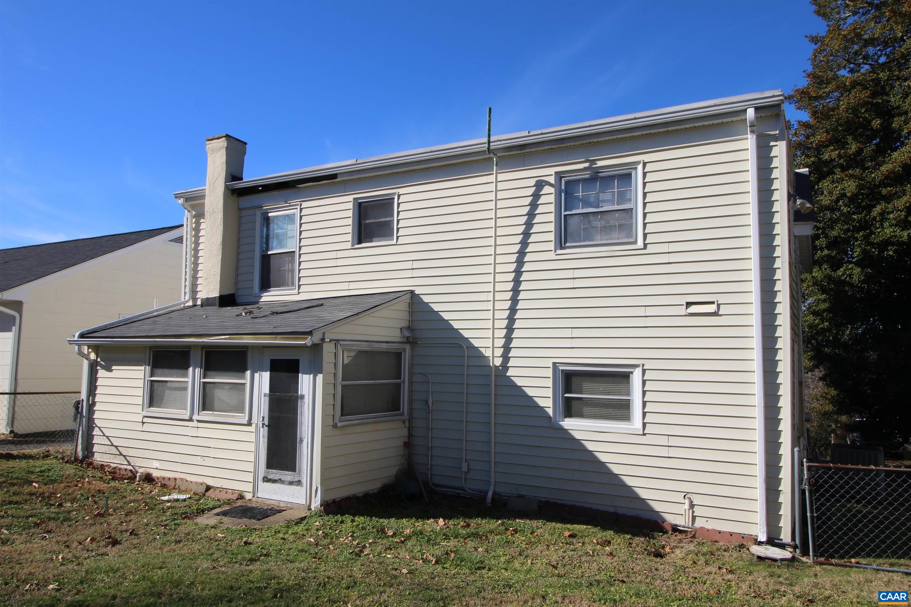 884 Ridge Street Charlottesville, VA 22902 - Photo 4 of 13 a front view of a house with a yard
