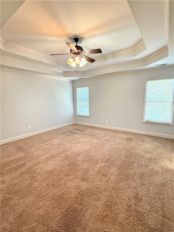 102 Oak Ridge Trail White, GA 30184 - Photo 16 of 37 en empty room with windows and ceiling fan