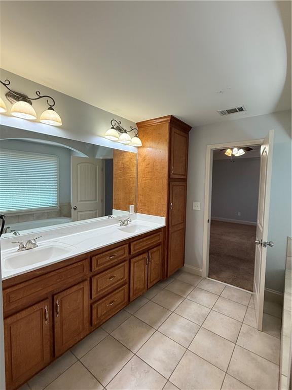102 Oak Ridge Trail White, GA 30184 - Photo 18 of 37 a bathroom with a double vanity sink and a mirror