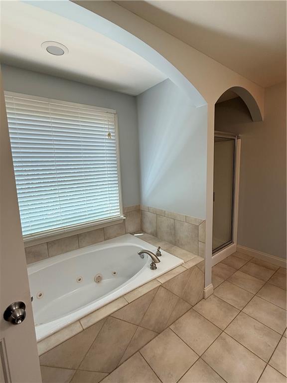 102 Oak Ridge Trail White, GA 30184 - Photo 20 of 37 a bathroom with a bathtub and a shower
