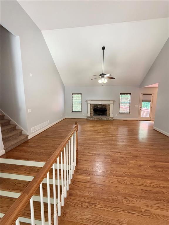 102 Oak Ridge Trail White, GA 30184 - Photo 6 of 37 a view of a livingroom with wooden floor fireplace and windows