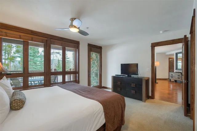 a bathroom with a granite countertop tub sink double and mirror