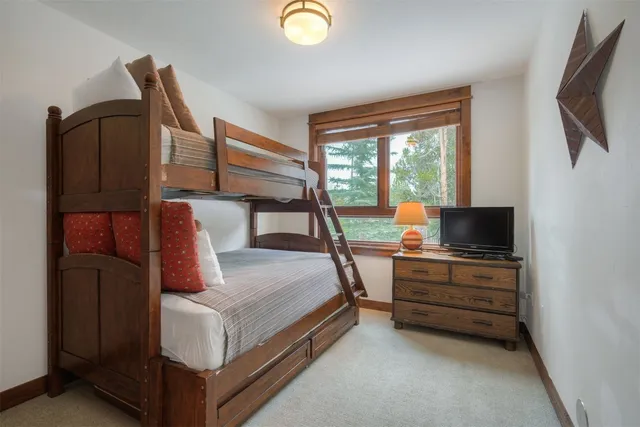a view of a porch with furniture and a yard