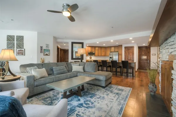 a living room with furniture and a fireplace