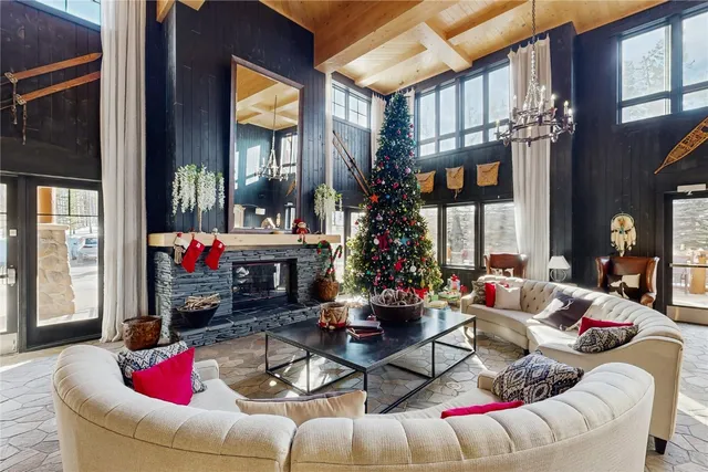 a living room with furniture pool table and a large window