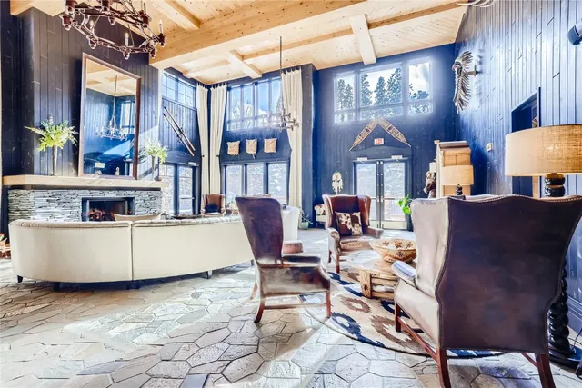 a living room with furniture and a lamp