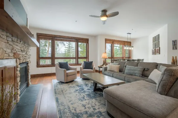 a living room with furniture and a fireplace