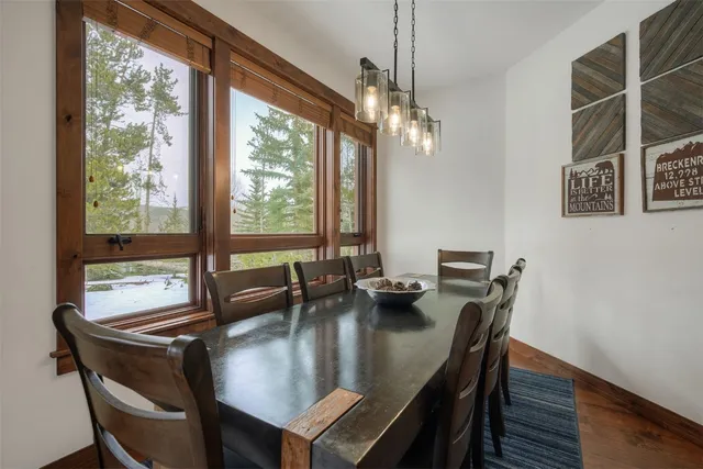 a dining room with furniture window wooden floor