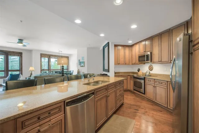 a bedroom with a large bed and a tv