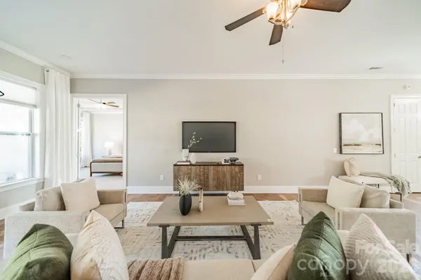 a living room with furniture and a flat screen tv