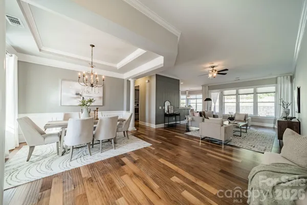 a view of a dining room with furniture window and wooden floor