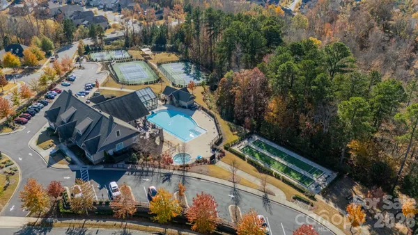 an aerial view of a house with a garden and trees