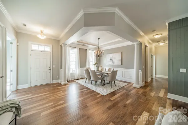 a view of a livingroom with furniture and wooden floor