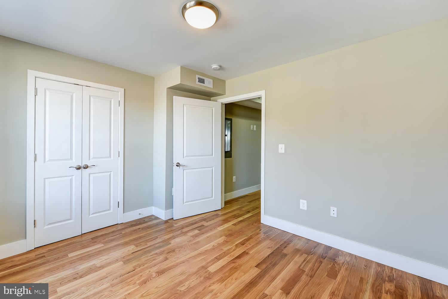 2031 Benning Road Northeast, Unit B Washington, DC 20002 - Photo 9 of 22 a view of a livingroom with wooden floor
