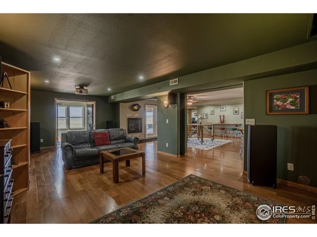 a living room with furniture window and wooden floor