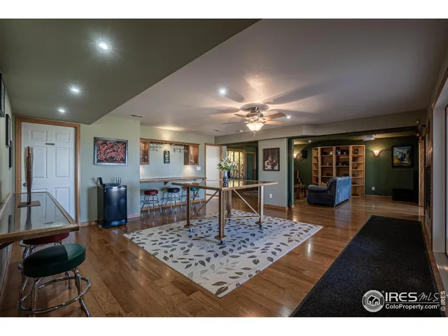a living room with dining room and kitchen view