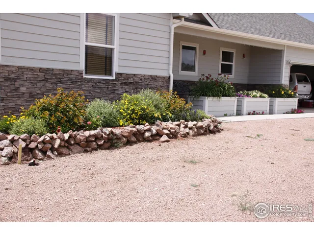 a view of a backyard of the house