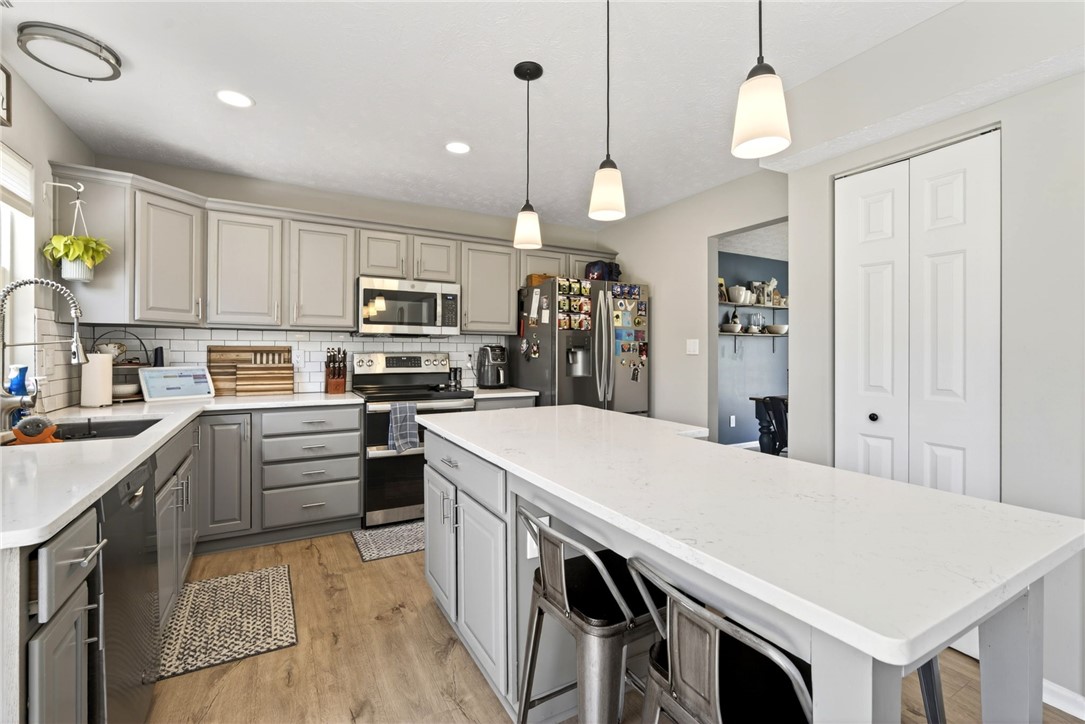 39 Holly Court Springboro, OH 45066 - Photo 11 of 42 This functional kitchen features ample counter space and modern amenities, perfect for everyday living.