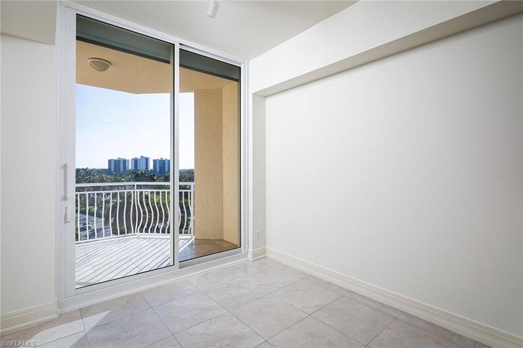 435 Dockside Drive, Unit B703 Naples, FL 34110 - Photo 15 of 38 a view of a room with a large window