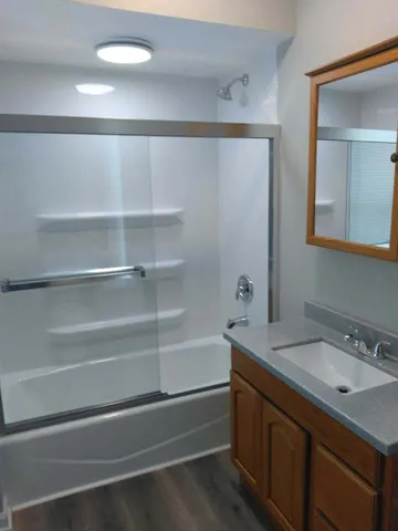 a kitchen with a stove a sink and a refrigerator