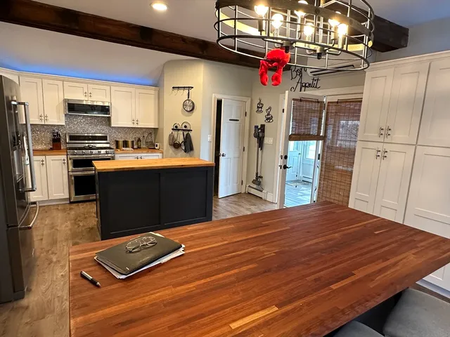 a living room with furniture rug and window