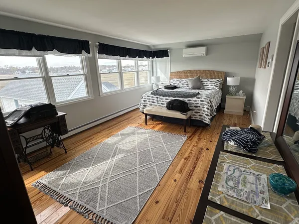 a bedroom with a bed and chair