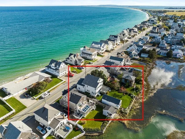 an aerial view of residential houses with outdoor space