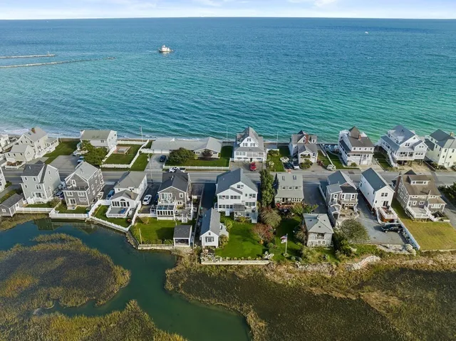 an aerial view of a house with a lake view