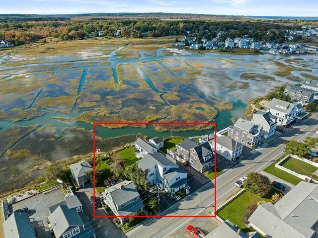 an aerial view of a house a garden and swimming pool