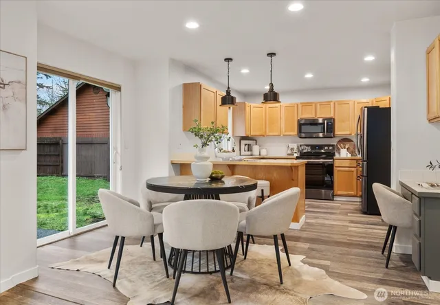 a living room with furniture and kitchen view