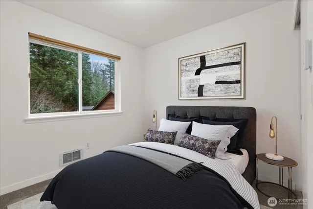 an aerial view of a house next to a yard