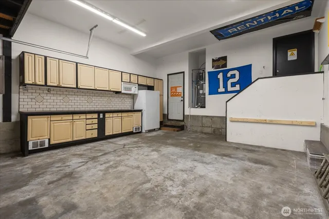 an aerial view of residential houses with outdoor space and street view