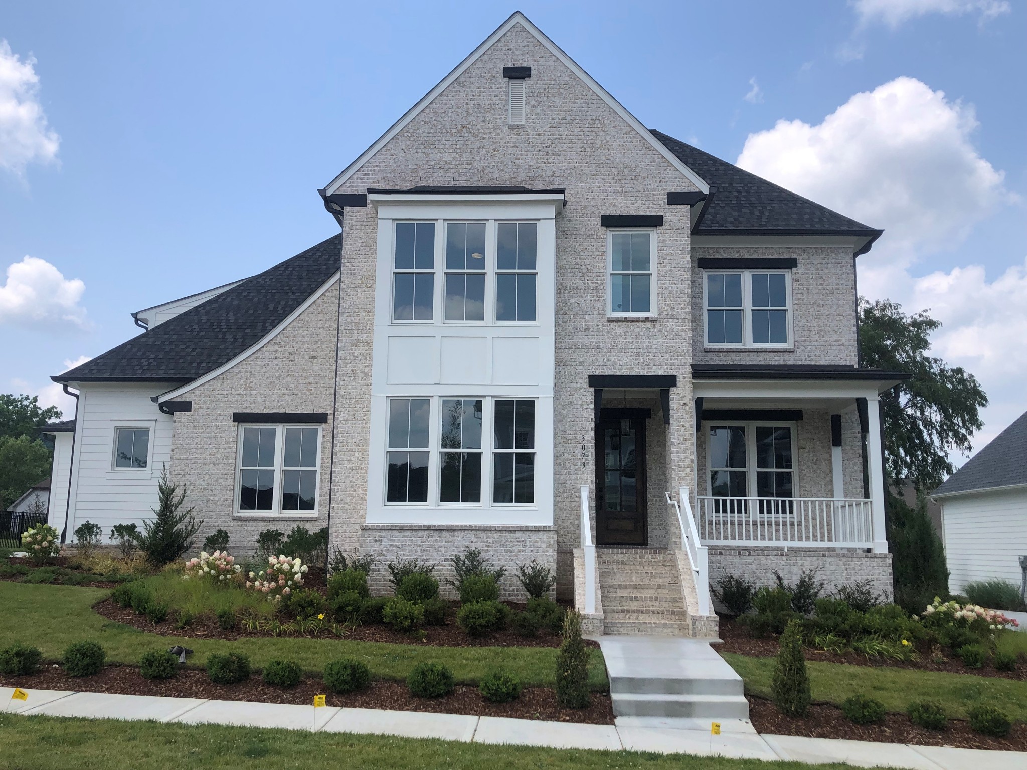 3073 Long Branch Circle Franklin, TN 37064 - Photo 1 of 13 a front view of a house with a yard