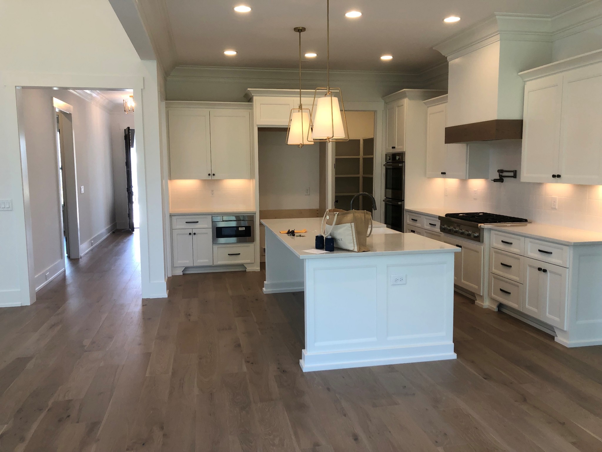 3073 Long Branch Circle Franklin, TN 37064 - Photo 4 of 13 a large kitchen with stainless steel appliances a large counter top a stove a sink and a refrigerator