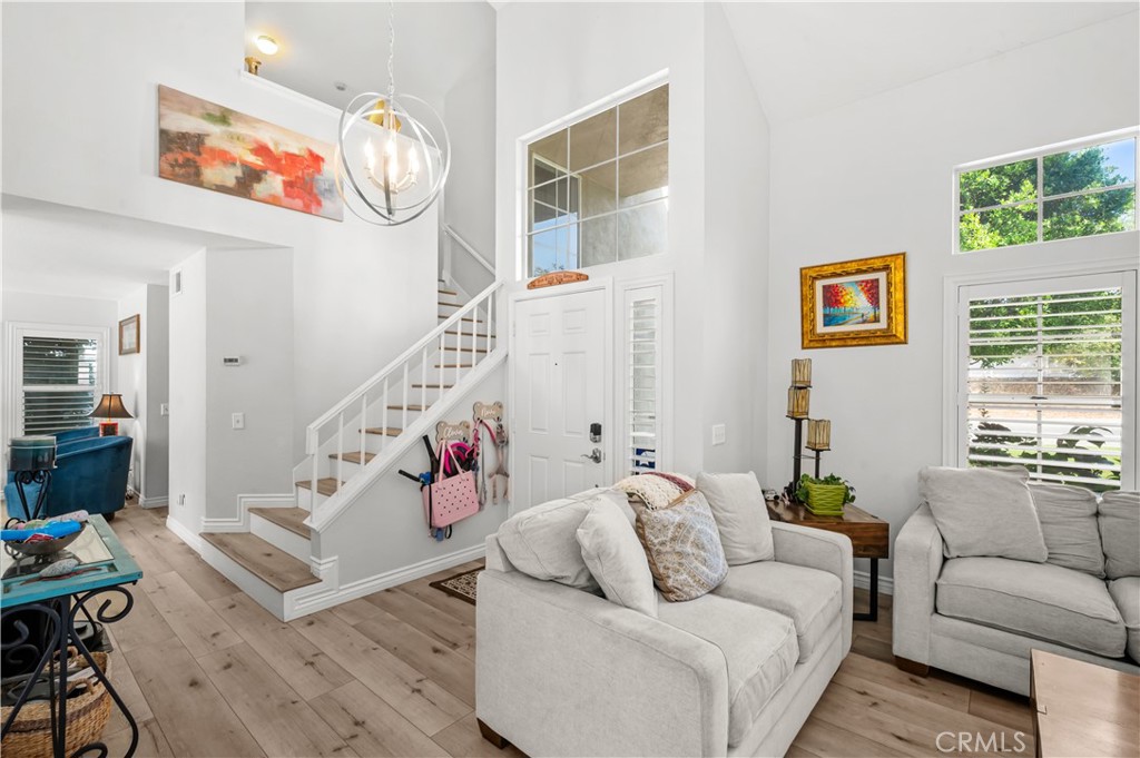 19465 Kinnow Lane Riverside, CA 92508 - Photo 5 of 61 a living room with furniture and a chandelier