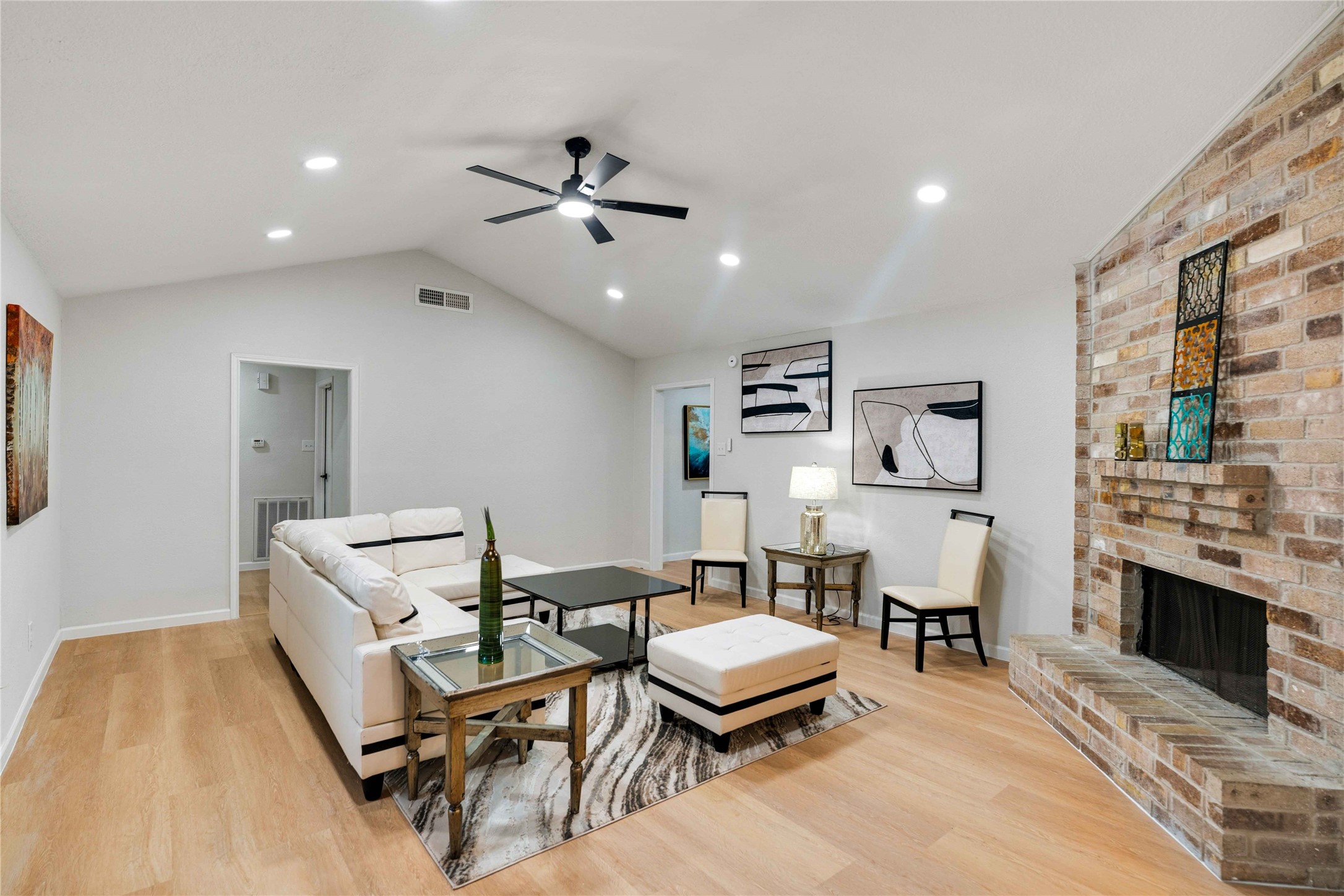 12703 Redfern Drive Houston, TX 77048 - Photo 4 of 28 Vaulted ceilings, modern fixtures, and neutral finishes create a move-in-ready atmosphere while still leaving room for your own creative vision and customization.