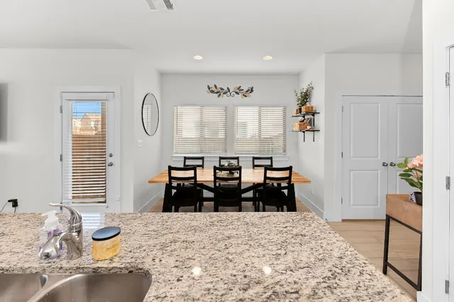 a kitchen with a sink and a refrigerator