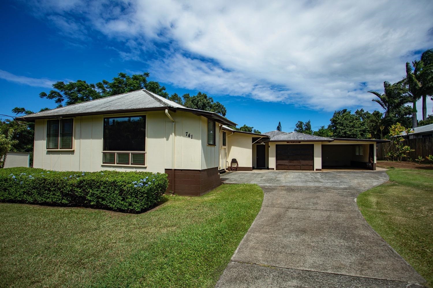 741 Haiku Road Haiku, HI 96708 - Photo 1 of 26 a front view of a house with garden