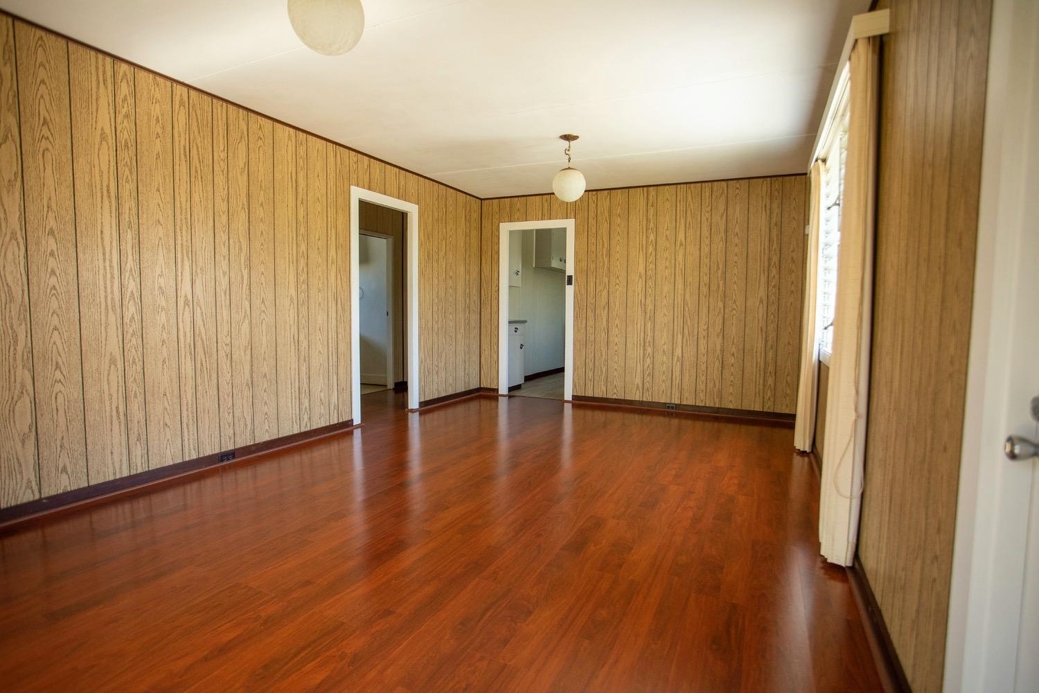 741 Haiku Road Haiku, HI 96708 - Photo 14 of 26 a view of a hallway with wooden floor