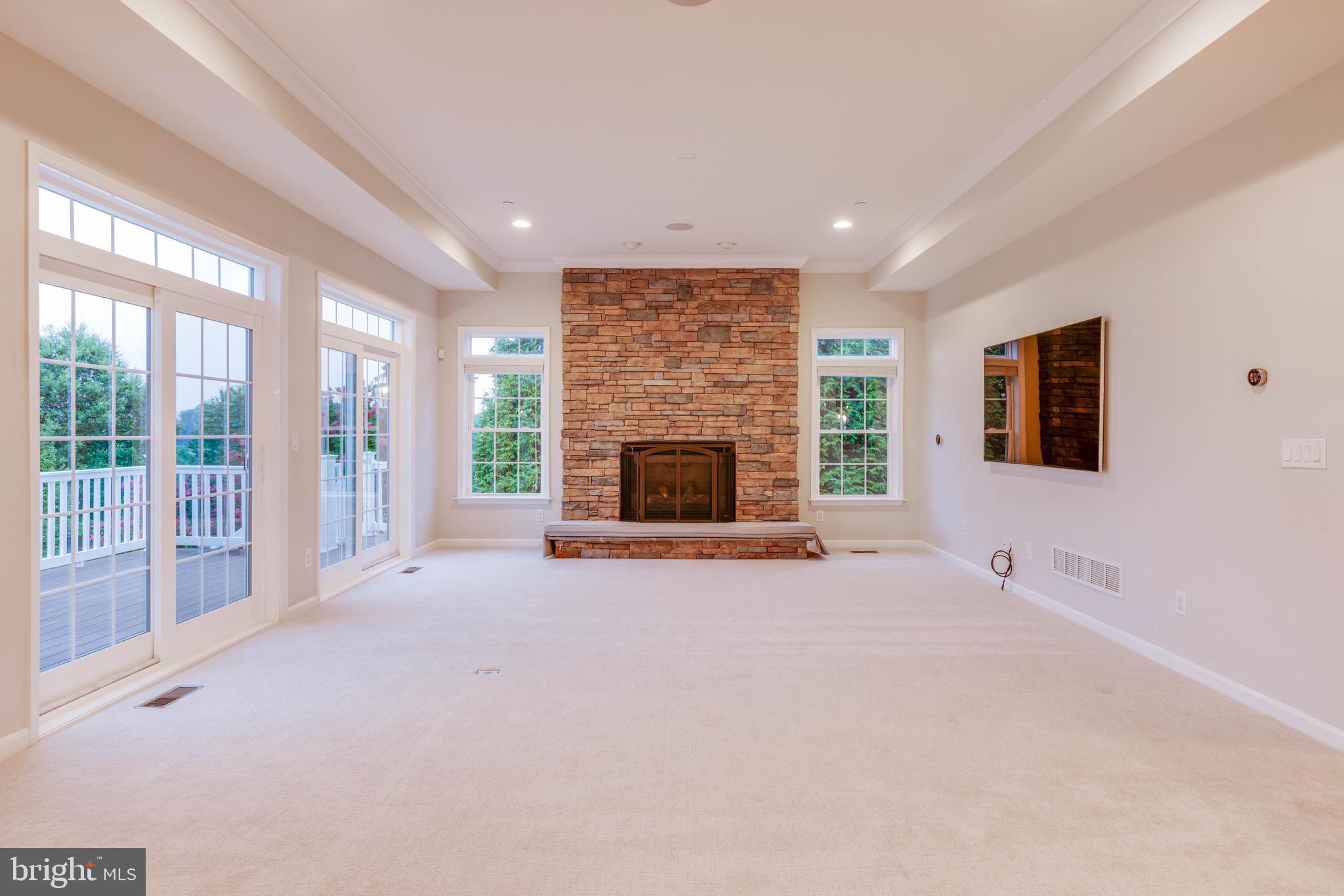 3913 Briar Knoll Circle Phoenix, MD 21131 - Photo 13 of 39 a view of an empty room with a fireplace and a window